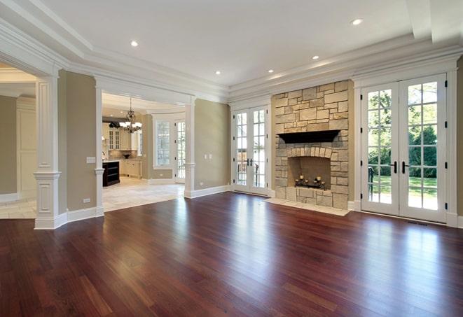 bright, light-colored hardwood floors in a spacious bedroom